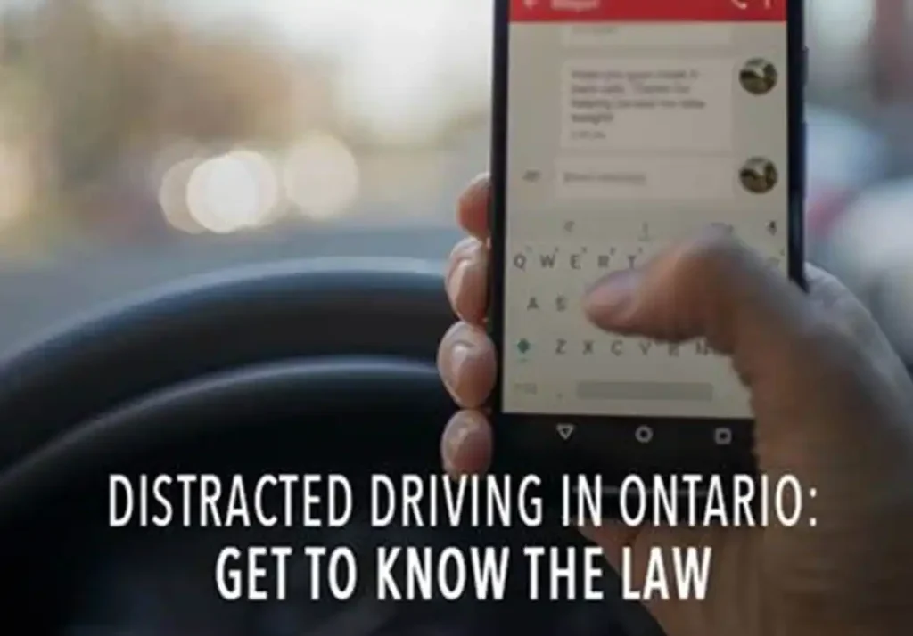 person holding cell phone while in car