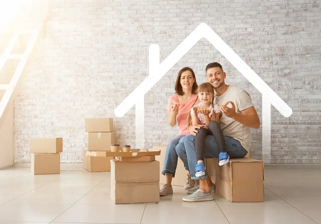 happy family sitting in their new home amid pile of boxes