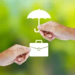 image of two hands holding white icons of a briefcase and an umbrella on a green bokeh background