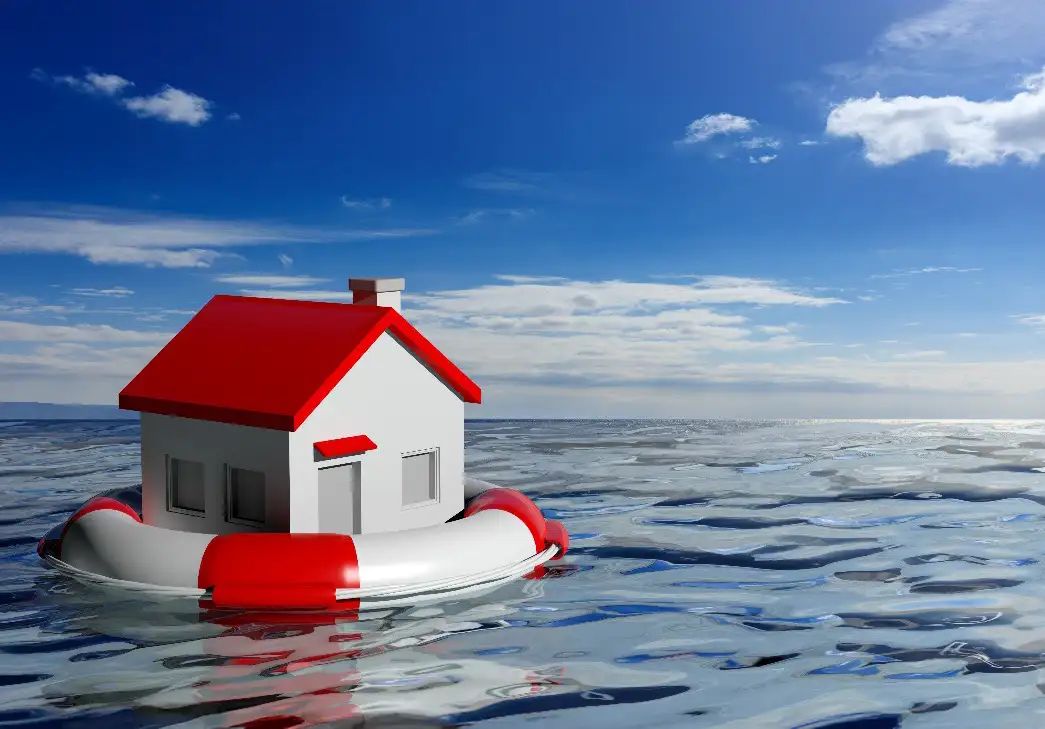 toy house floating on endless water inside a red and white life preserver